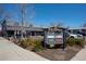 Retail center with visible signage, landscaping, and a variety of storefronts in a commercial area at 1668 Holeman Dr, Erie, CO 80516