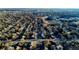 Aerial view of a neighborhood showcasing tree-lined streets and a mix of residential homes at 6717 Lee St, Arvada, CO 80004