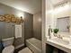 Stylish bathroom with vanity, bathtub and decorative wall art at 6717 Lee St, Arvada, CO 80004