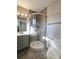 Updated bathroom with corner shower, modern vanity and fixtures at 6717 Lee St, Arvada, CO 80004