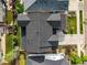An aerial view of home and neighborhood, highlighting roof and backyard at 15033 Delhi Ave, Parker, CO 80134
