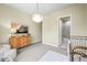 Bedroom with decor, plush rug, and chandelier near an ensuite bathroom at 15033 Delhi Ave, Parker, CO 80134