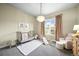 Charming Bedroom features a plush rug, chandelier, and play area at 15033 Delhi Ave, Parker, CO 80134