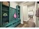 Inviting mudroom with built-in storage, hooks, and bench for organized entryway at 15033 Delhi Ave, Parker, CO 80134