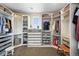 Spacious walk-in closet with custom shelving, drawers, and ample storage for organized wardrobe management at 15033 Delhi Ave, Parker, CO 80134