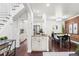 Dining area featuring sleek bar seating and an open kitchen concept at 1832 W 36Th Ave, Denver, CO 80211