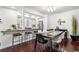 Bright dining room showcasing modern furnishings and bar top access to kitchen at 1832 W 36Th Ave, Denver, CO 80211