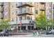 Street corner view of restaurant with outdoor seating and modern architecture at 1832 W 36Th Ave, Denver, CO 80211