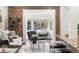 Cozy living room featuring exposed brick and comfortable seating near the sun room at 1832 W 36Th Ave, Denver, CO 80211
