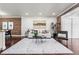Spacious living room features brick accents, recessed lighting, and hardwood floors at 1832 W 36Th Ave, Denver, CO 80211