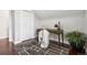 Charming office with a vintage desk, modern chair, geometric rug, and closet for ample storage at 1832 W 36Th Ave, Denver, CO 80211