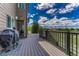 Relax on this wooden back deck, perfect for grilling and outdoor enjoyment at 9315 E Aspen Hill Ln, Lone Tree, CO 80124
