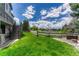 Lush backyard with a deck and fence, perfect for relaxation and privacy at 9315 E Aspen Hill Ln, Lone Tree, CO 80124