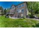 Expansive backyard with a deck and firepit, perfect for outdoor relaxation and entertaining at 9315 E Aspen Hill Ln, Lone Tree, CO 80124