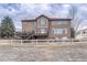 Exterior of home features spacious backyard, deck, patio and fence at 9315 E Aspen Hill Ln, Lone Tree, CO 80124