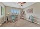 Bright bedroom with an art station, a window, desk, and a comfortable chair at 9315 E Aspen Hill Ln, Lone Tree, CO 80124