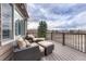 Relax on this deck with comfortable seating, overlooking a beautiful backyard at 9315 E Aspen Hill Ln, Lone Tree, CO 80124