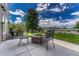 Cozy outdoor seating area featuring a stone fire pit, ideal for entertaining guests at 9315 E Aspen Hill Ln, Lone Tree, CO 80124