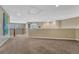 Upstairs hallway featuring carpet, railing, and neutral paint at 9315 E Aspen Hill Ln, Lone Tree, CO 80124