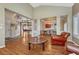 Spacious living room with hardwood floors, open floor plan, and chandelier at 9315 E Aspen Hill Ln, Lone Tree, CO 80124