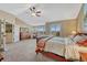 Light-filled main bedroom with high ceilings, shuttered windows, and carpet at 9315 E Aspen Hill Ln, Lone Tree, CO 80124