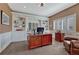 Home office features custom built-in bookshelves, wainscoting, and a large wooden desk at 9315 E Aspen Hill Ln, Lone Tree, CO 80124