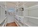 Walk-in pantry with custom shelving and drawers maximizes storage and organization at 9315 E Aspen Hill Ln, Lone Tree, CO 80124