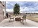 Paver patio with fire pit and comfortable seating perfect for entertaining at 9315 E Aspen Hill Ln, Lone Tree, CO 80124