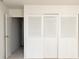 Bedroom closet features louvered doors at 1200 N Humboldt St # 1204, Denver, CO 80218