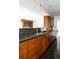 Stylish kitchen showcasing granite countertops, ample wood cabinetry, and modern appliances at 1200 N Humboldt St # 1204, Denver, CO 80218