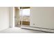 Bright living room featuring a sliding door to a balcony with city views at 1200 N Humboldt St # 1204, Denver, CO 80218
