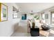 A bright living room with an open layout, modern furnishings, and an art piece providing pops of color at 1200 N Humboldt St # 1204, Denver, CO 80218
