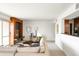 Open-concept living room features a fireplace, comfortable seating, and access to a balcony at 1200 N Humboldt St # 1204, Denver, CO 80218