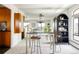 Modern living space featuring a bar with bar stools, mirrored walls and an open-concept design at 1200 N Humboldt St # 1204, Denver, CO 80218