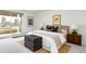 Cozy bedroom with natural light, complemented by chic decor and balcony access at 1200 N Humboldt St # 1204, Denver, CO 80218