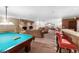 Spacious recreation room featuring a fireplace, pool table, and bar area at 1200 N Humboldt St # 1204, Denver, CO 80218