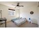 Bedroom with a ceiling fan, natural light, and a simple decor at 13725 Ash Cir, Thornton, CO 80602