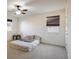 Bedroom with carpet, ceiling fan, natural light, and minimalist decor at 13725 Ash Cir, Thornton, CO 80602