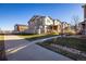 Picturesque street view of townhomes, manicured lawns, and sidewalks for an inviting neighborhood feel at 13725 Ash Cir, Thornton, CO 80602