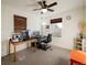 Brightly lit office space with a ceiling fan, two windows, and modern computer setup at 13725 Ash Cir, Thornton, CO 80602