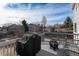Relax and enjoy the outdoors on this back deck with a grill and cozy fire pit at 11866 High Desert Rd, Parker, CO 80134