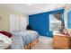 This bedroom has a double bed, built-in wardrobe and a window that provides natural light at 11866 High Desert Rd, Parker, CO 80134