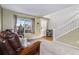 Bright foyer with staircase, natural light, and a view of the neighborhood at 11866 High Desert Rd, Parker, CO 80134