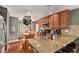 Modern kitchen with granite countertops, stainless steel appliances, and ample cabinet space at 11866 High Desert Rd, Parker, CO 80134