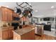 Bright kitchen features wooden cabinetry, granite countertops, and stainless steel appliances at 11866 High Desert Rd, Parker, CO 80134