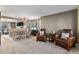 Cozy living room featuring comfortable seating, neutral carpet, and an open layout at 11866 High Desert Rd, Parker, CO 80134