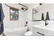 Bright, modern bathroom featuring a soaking tub and sleek vanity at 236 Harris Dr, Idaho Springs, CO 80452