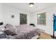Cozy bedroom featuring wood-trimmed windows offering natural light at 236 Harris Dr, Idaho Springs, CO 80452
