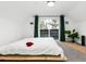 Bright bedroom with balcony access and minimalist decor at 236 Harris Dr, Idaho Springs, CO 80452