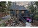 Charming home with a deck and hot tub, surrounded by trees at 236 Harris Dr, Idaho Springs, CO 80452
